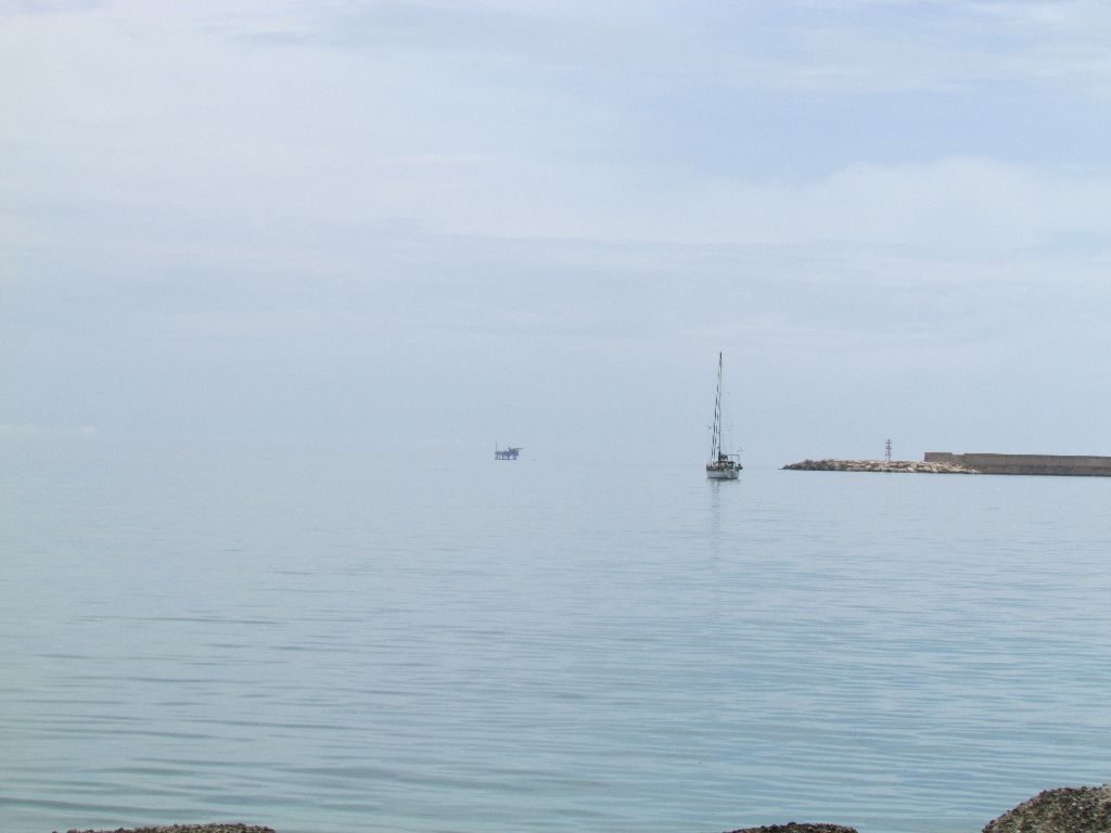 A lot of grey. Emerald in the north anchorage at Crotone