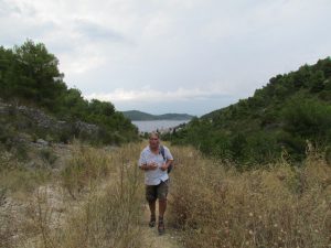 Heading up a hill with a storm rolling in - we must be nuts!