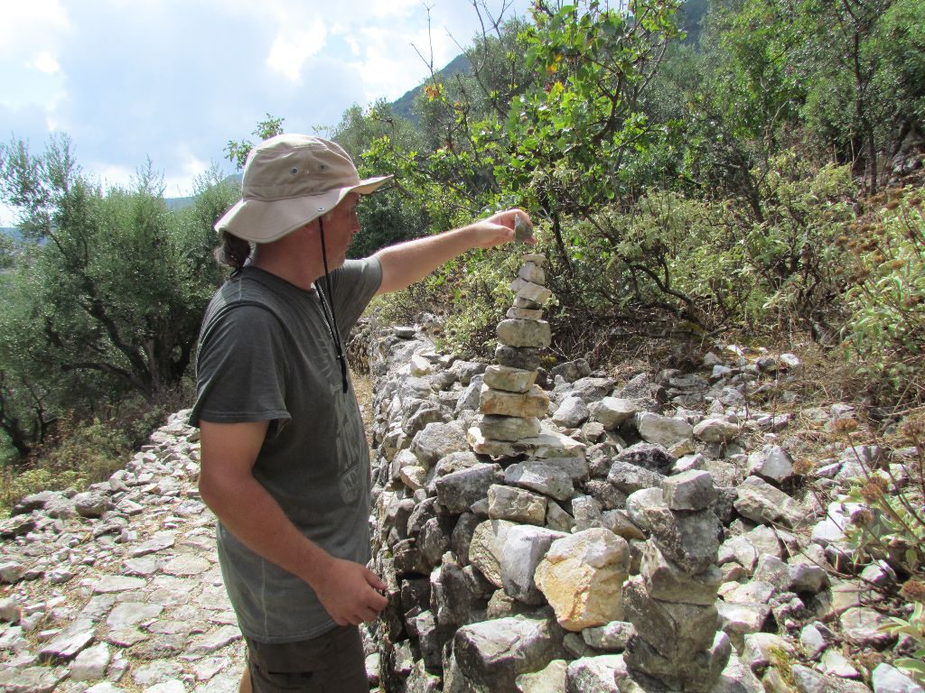 Building up a cairn along the walk