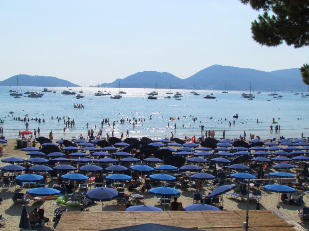 The busy beach and anchorage at Lerici