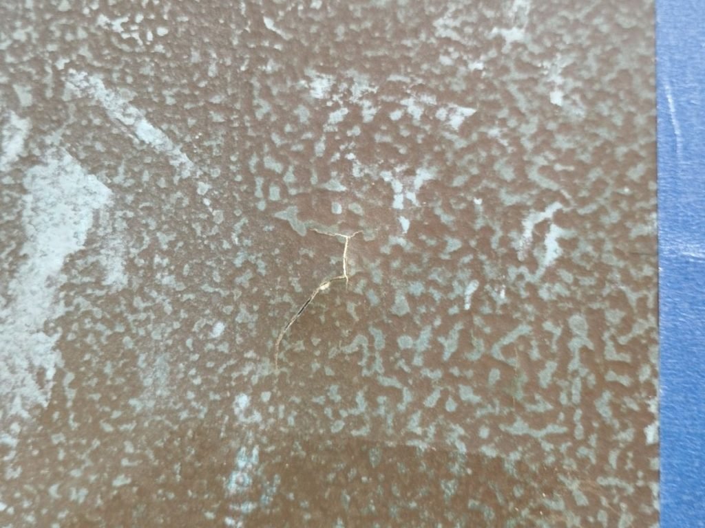 Close up of a crack in a boat's hull